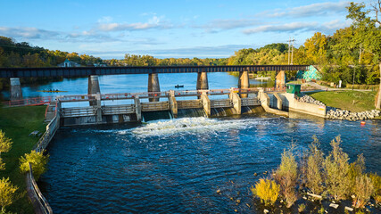 Aerial View of Argo Dam, Rowing Team, and Railway Bridge at Golden Hour