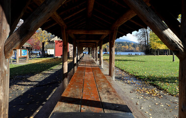 Perspective of long wooden bench in the park