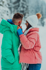 On a snowy Valentine's Day, this romantic couple shares warmth, laughter, and tender embraces, creating a blissful winter love story.