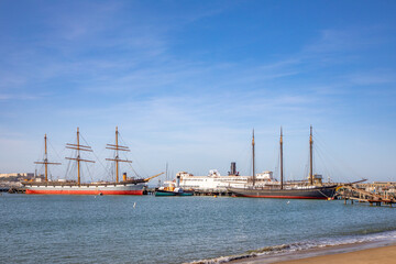 view to Hyde park pier in San Francisco with historic ships like sailors and ferries