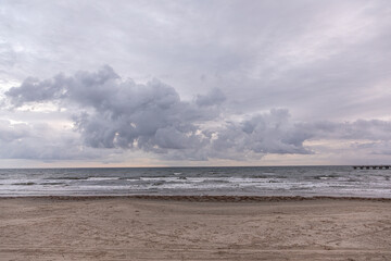 dark clouds at the sandy beach in Galveston,  USA
