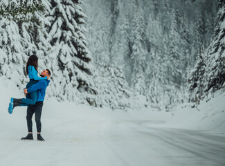 On a snowy Valentine's Day, this romantic couple shares warmth, laughter, and tender embraces, creating a blissful winter love story.