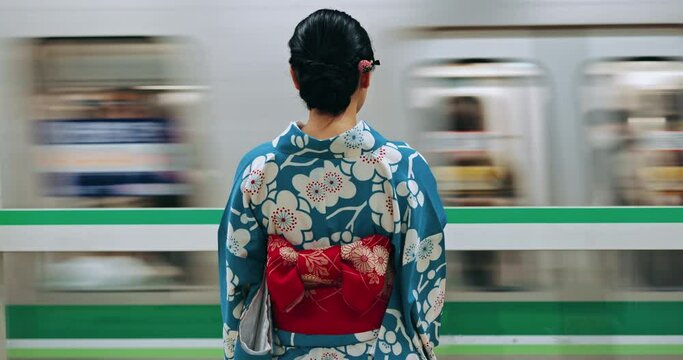 Japanese woman, back and train station for travel with fast vehicle, motion blur and traditional clothes. Person, indigenous fashion and style for culture in city for metro transport with locomotive
