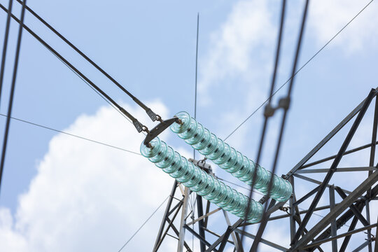 Glass Prefabricated Voltage Insulators on Poles High-voltage Power in a Mexican power plant on a tower