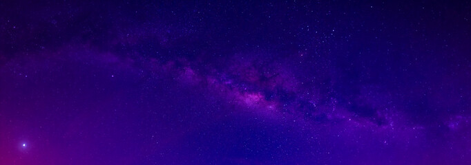 Fototapeta na wymiar Panorama purple,blue night sky milky way and star on dark background.Universe filled with stars, nebula and galaxy with noise and grain.Photo by long exposure and select white balance.