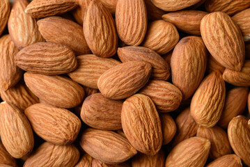Raw almond texture background, top view