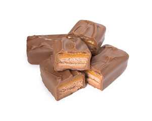 Pieces of tasty chocolate bars with nougat on white background