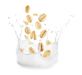 Rolled oats falling into splashing milk on white background