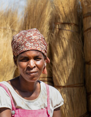 portrait of an village african woman outdoors in a sunny day in the field