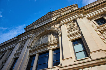 Fototapeta na wymiar Majestic Courthouse Architecture, Blue Sky, Low-Angle View