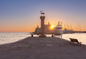 Old stone lighthouse in Fort St. Nicholas in Rhodes early in the morning.