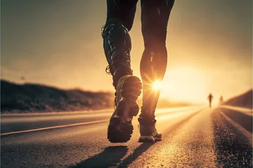 Fototapeten close up on the leggs of an athletic man walking on a road into the sunset © eurasiansparrow