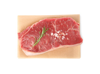 Steak of raw beef meat and spices isolated on white, top view