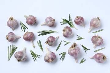 Fresh garlic and rosemary on white background, flat lay