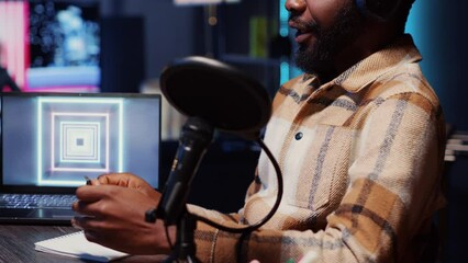 Man invited on charitable podcast talking during marathon streaming live broadcast for good humanitarian cause, gathering donations from viewers, entertaining audience, close up shot