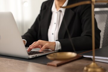 Notary using laptop at workplace in office, closeup