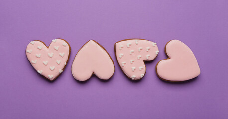 Heart shaped sweet cookies on purple background. Valentine's day celebration