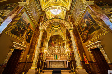Fototapeta na wymiar Opulent Church Altar and Marble Columns, Stained Glass Glow