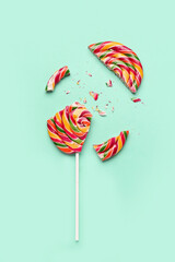 Crushed colorful lollipop on turquoise background