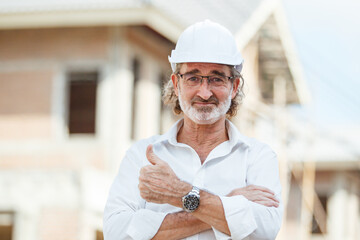 Senior foreman at construction site portrait.