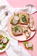 Plates with delicious radish bruschettas on pink background