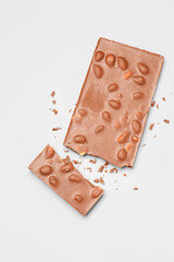 Sweet tasty chocolate with nuts on  light background