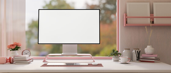 Beautiful, modern girlie pink computer desk with a computer on a white desk with pink accessories. - obrazy, fototapety, plakaty