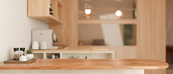 Copy space on a wooden kitchen countertop in a minimalist Scandinavian kitchen.