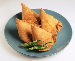 Veg Samosa - is a crispy and spicy Indian triangle shape snack which has crisp outer layer of maida...