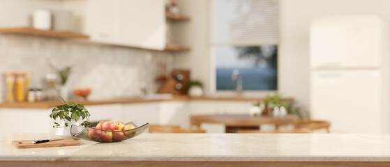 A copy space on a luxury white marble kitchen tabletop in a modern white kitchen. close-up image