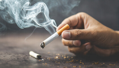 Close-up of hand crushing a burning cigarette, symbolizing determination to quit smoking - obrazy, fototapety, plakaty