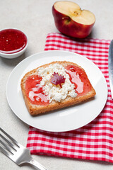 Table setting with tasty toast on white background, closeup. Canadian flag concept