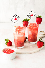 Strawberry lemonade made with fresh puree and topped with bubble pearls.