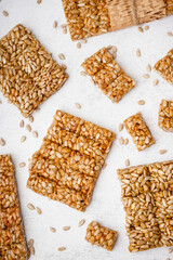 Assortment of tasty kozinaki on white background