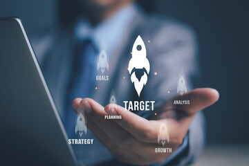 Businessman holding rocket icon with target, growth, goal, strategy and analysis