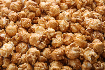Tasty caramel popcorn as background