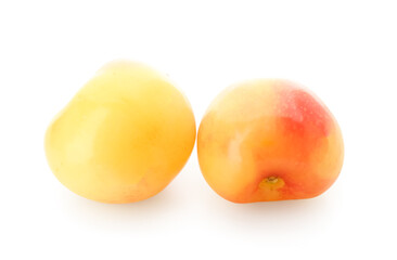 Sweet yellow cherries on white background