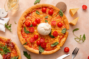Wooden board of tasty pizza with Burrata cheese on beige background