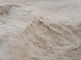 Fototapeta na wymiar Many pits on sand, Caused by people's footprint