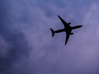 The Silhouette and shape of an airplane in the sky