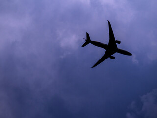 The Silhouette and shape of an airplane in the sky