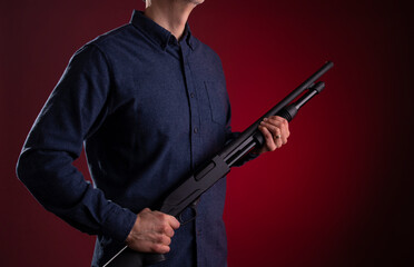 Armed citizen holding a shotgun