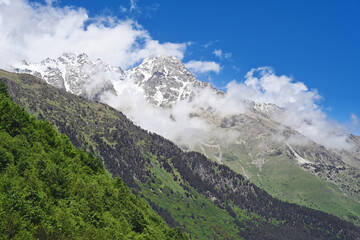 Fototapeta na wymiar Cloudy mountains of the Digora Gorge in summer