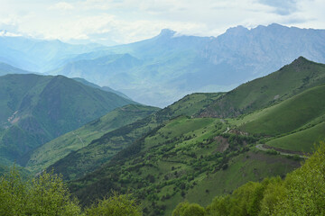 Fototapeta premium Green mountain relief of the Arkhonsky Pass