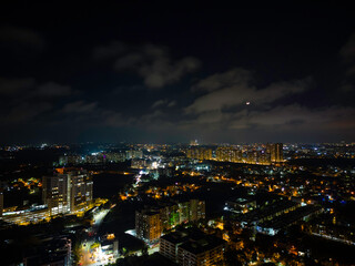 Fototapeta premium Bangalore Nightscape: Glowing Skyscrapers Illuminate the City
