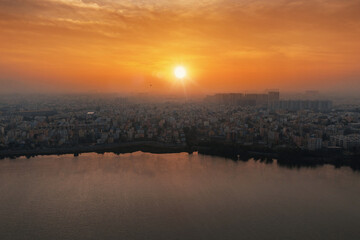 sun rises over Madiwala Lake in Bangalore, India