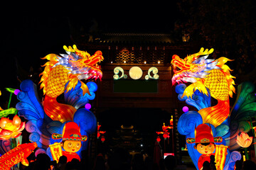 Happy Chinese New Year, the year of the dragon. Scenery in NanJing city. Glowing zodiac symbols, .