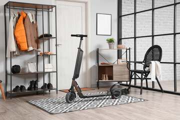 Interior of stylish hall with electric scooter and coat rack