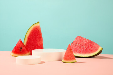 Collection of round shaped podiums displayed with fresh watermelon slices. Vacant space on the podiums to show beauty products extracted from Watermelon