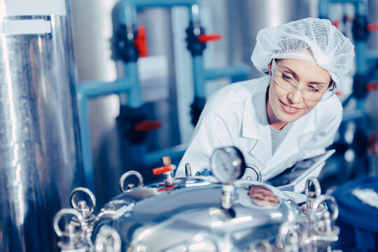 staff work in science medical lab factory check record pressure tank happy working